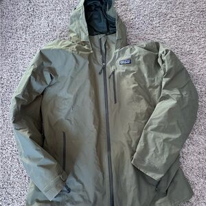 Patagonia Green Raincoat with Hood and Water-Resistant Material
